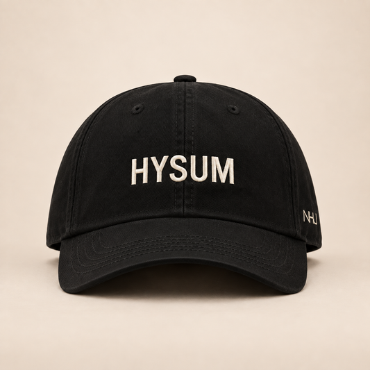HYSUM Embroidered Cap on a warm beige studio background