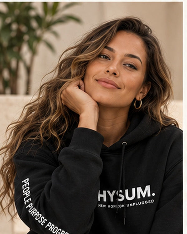 New Horizon Unplugged female model wearing black HYSUM hoodie with full face visible