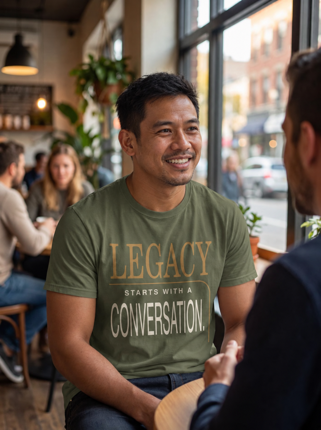 Southeast Asian man wearing the New Horizon Unplugged Legacy Starts With a Conversation shirt